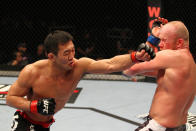 SAITAMA, JAPAN - FEBRUARY 26: (L-R) Yushin Okami punches Tim Boetsch during the UFC 144 event at Saitama Super Arena on February 26, 2012 in Saitama, Japan.