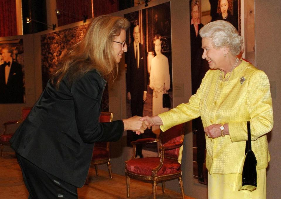 Queen Elizabeth II greets photographer Annie Leibovitz during a reception at Buckingham Palace for Americans in the UK (PA)