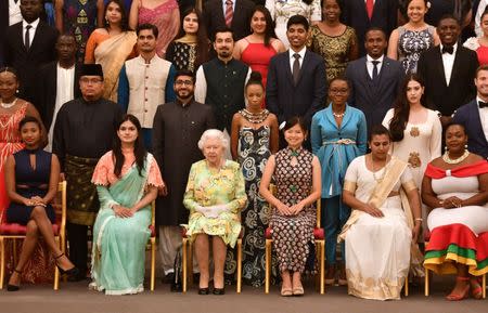 Britain's Queen Elizabeth poses for a picture with some of Queen's Young Leaders at a Buckingham Palace reception following the final Queen's Young Leaders Awards Ceremony, in London, Britain June 26, 2018. John Stillwell/Pool via Reuters