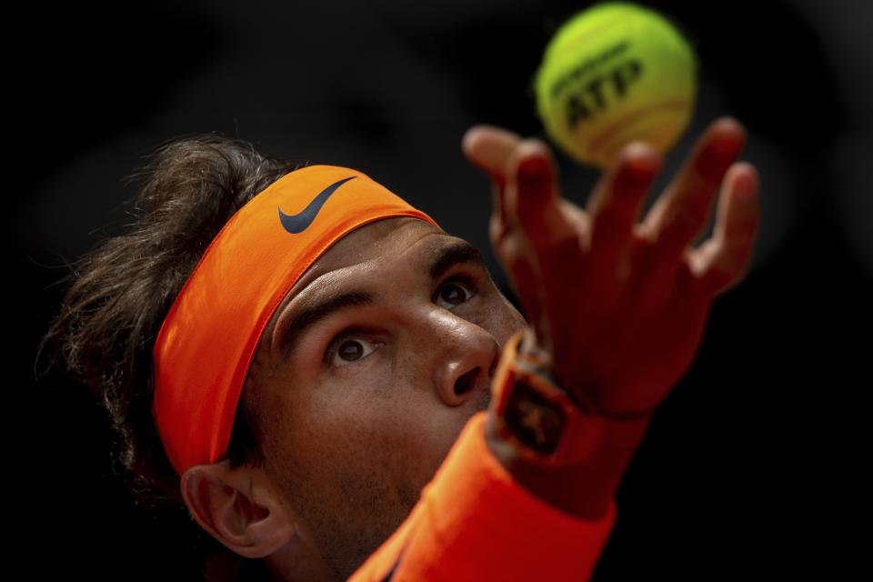 Rafael Nadal, from Spain, serves to Felix Auger-Aliassime, from Canada, during the Madrid Open tennis match in Madrid, Wednesday, May 8, 2019. (AP Photo/Bernat Armangue)