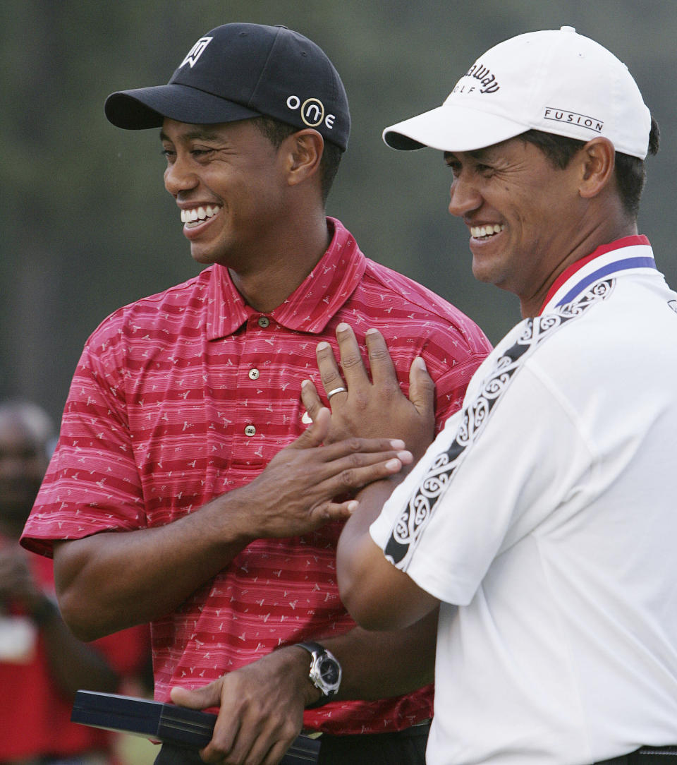 FILE - U.S. Open winner Michael Campbell, right, of New Zealand, poses with Tiger Woods after the 105th US Open Championship at the Pinehurst Resort and Country Club's No. 2 course in Pinehurst, N.C., Sunday, June 19, 2005. The U.S. Open returns to Pinehurst for a fourth time. (AP Photo/Julie Jacobson, File)