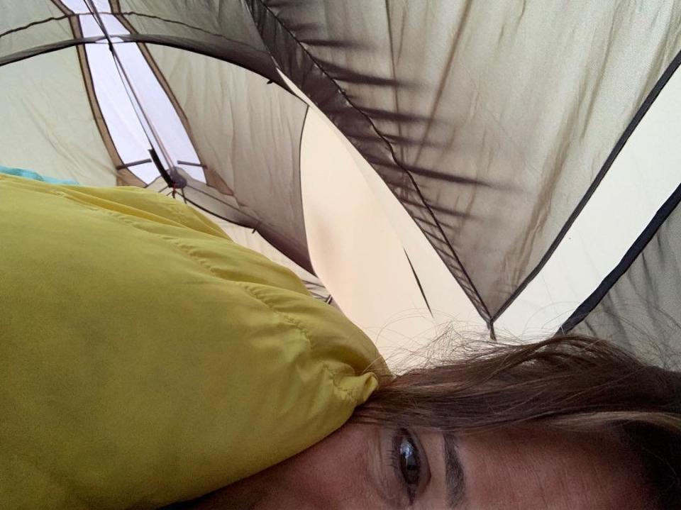 When she did her best to "camp" with her kids, she was in dire need of coffee. She captioned this sleeping bag snap, "Backyard campout. Kids still sleeping. Sprinklers. 😑 #👵🏼👵🏼👵🏼 #whencanihavecoffee"