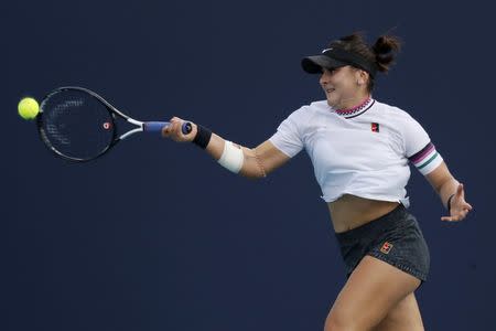 Mar 21, 2019; Miami Gardens, FL, USA; Bianca Andreescu of Canada hits a forehand against Irina-Camelia Begu of Romania (not pictured) in the first round of the Miami Open at Miami Open Tennis Complex. Mandatory Credit: Geoff Burke-USA TODAY Sports