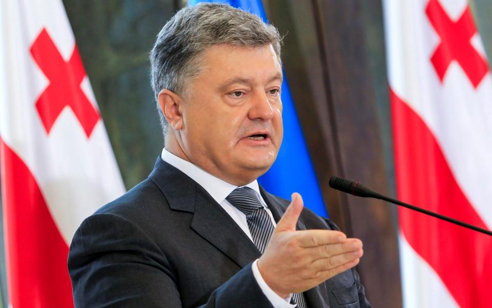 Petro Poroshenko speaks at a press conference during his meeting with Georgian President Georgy Margvelashvili in Tbilisi on Tuesday - Credit: Shakh Aivazov/AP