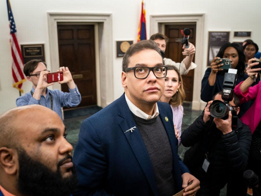 Reporters surround embattled Rep. George Santos as he heads to the House Chamber for a vote, at the US Capitol on Tuesday, January 31, 2023 in Washington, DC.