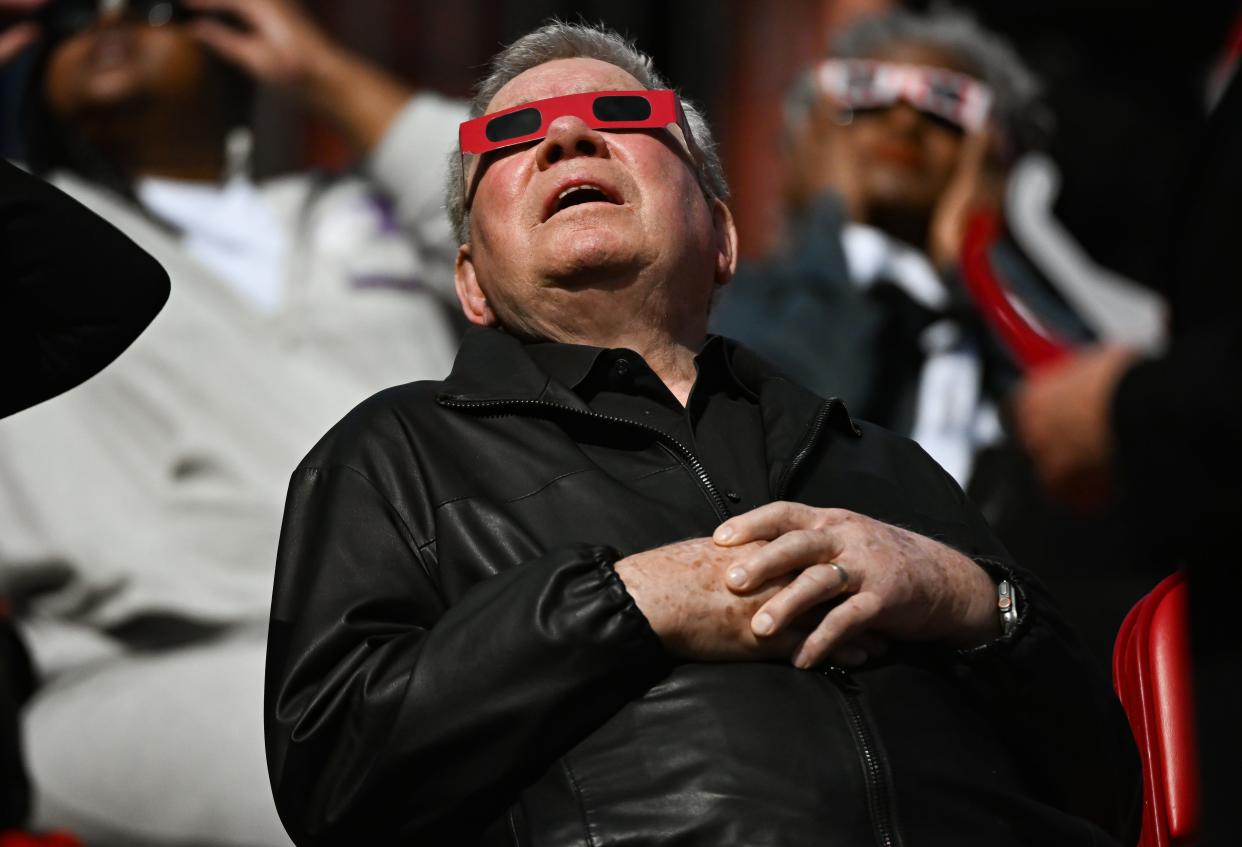 William Shatner watches the eclipse during the Hoosier Cosmic Celebration at Memorial Stadium on Monday, April 8, 2024.