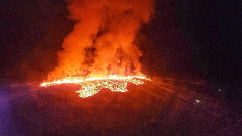 Billowing smoke and flowing lava are seen in this Icelandic Department of Civil Protection and Emergency Management image taken on Sunday (AFP via Getty Images)