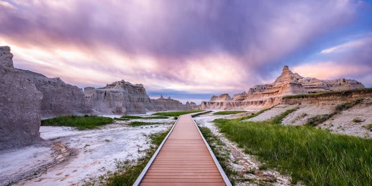 The light at dawn peeks through the Window Trail at Badlands National Park.