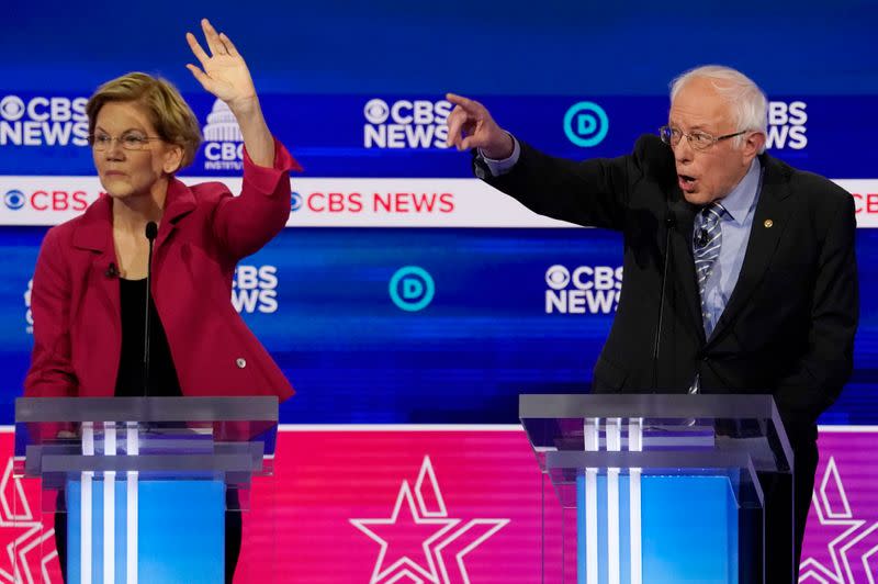 Democratic 2020 U.S. presidential candidates Senator Warren listens as Senator Sanders speaks during the tenth Democratic 2020 presidential debate in Charleston, South Carolina, U.S.