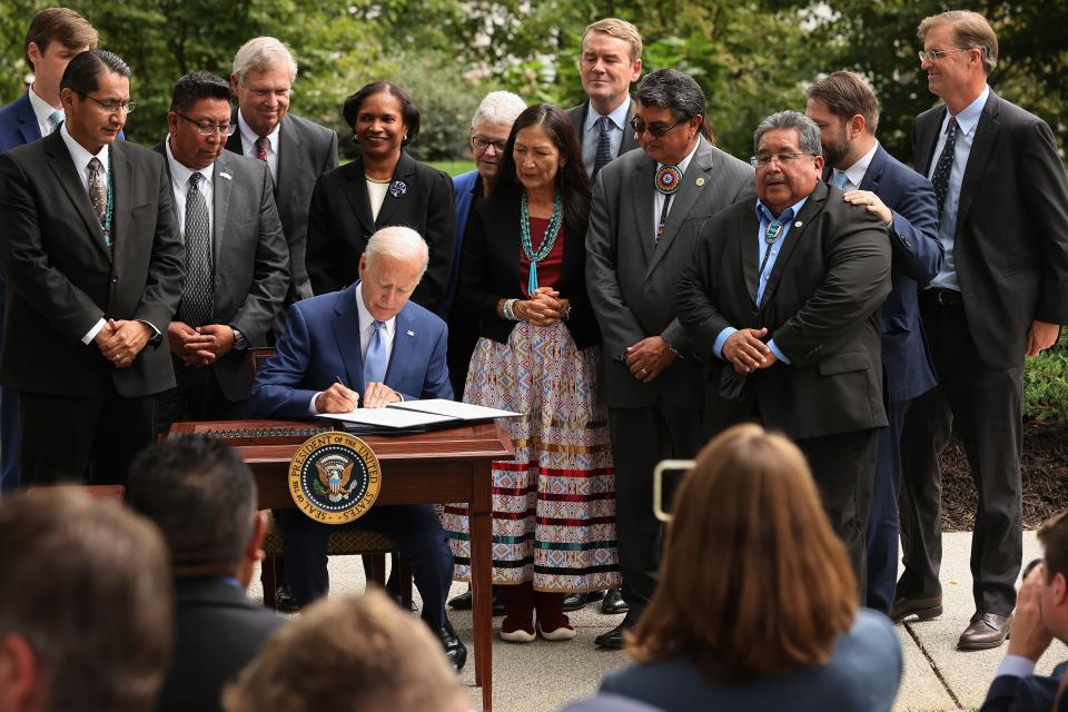 WASHINGTON, DC - President Joe Biden signs proclamations expanding areas of three national monuments at the White House in October 2021 in Washington, DC. Biden restored areas of two Utah parks, Bears Ears National Monument and the Grand Staircase-Escalante, lands held sacred by several Native American tribes; as well as the Northeast Canyons and Seamounts of the New England coast, after former President Donald Trump opened them to mining, drilling and development.