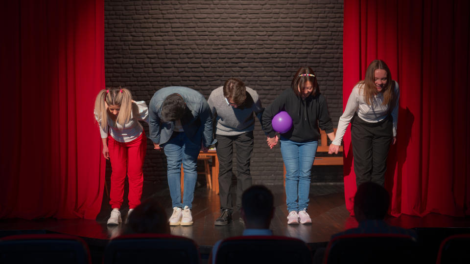 People taking a bow onstage