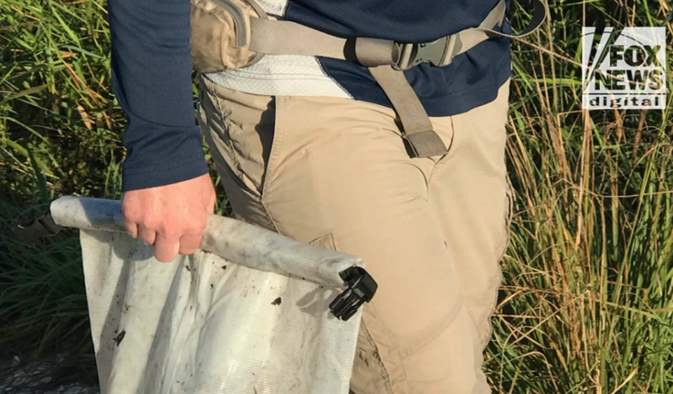 A bag containing personal items belonging to Brian Laundrie is removed from the Myakkahatchee Creek Environmental Park on Wednesday morning (Fox News)