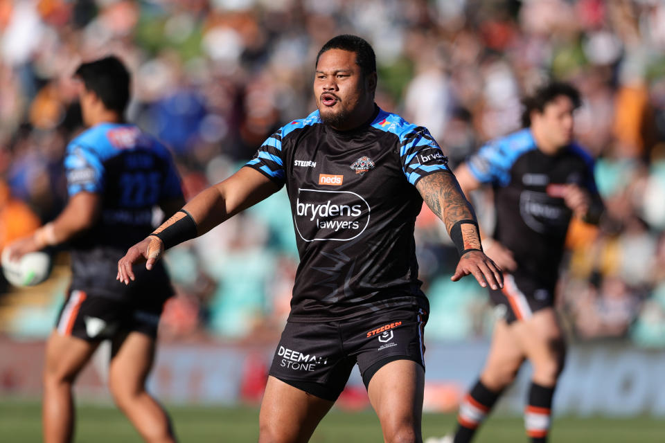 Joey Leilua (pictured) warms up.