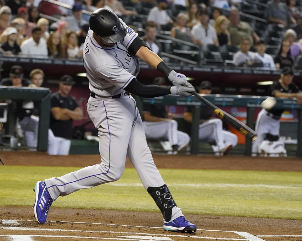 Colorado Rockies' Kris Bryant connects for a home run off of Arizona Diamondbacks starting pitcher Madison Bumgarner during the first inning of a baseball game Saturday July 9, 2022, in Phoenix. (AP Photo/Darryl Webb)