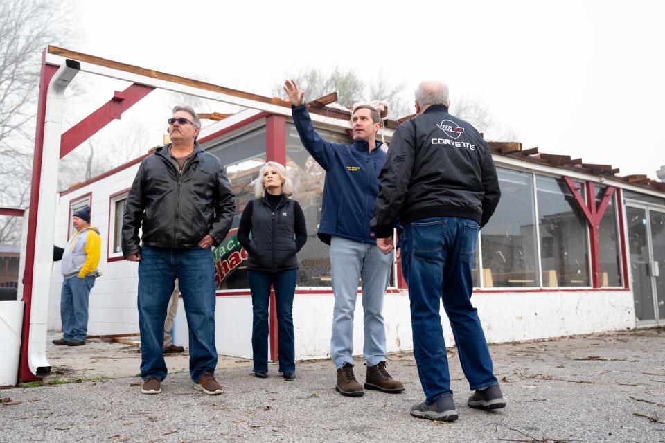 Governor Andy Beshear walks around the town of Milton, Ky. on Saturday, March 16, 2024 to see the damage caused by a tornado that came through the town on Thursday, March 14.