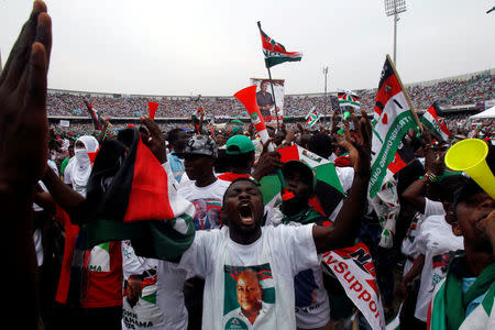 Supporters of John Dramani Mahama, Ghana's president and National Democratic Congress (NDC) presidential candidate celabrate as they attend his rally at Accra sport stadium, in Accra, Ghana December 5, 2016. REUTERS/Luc Gnago