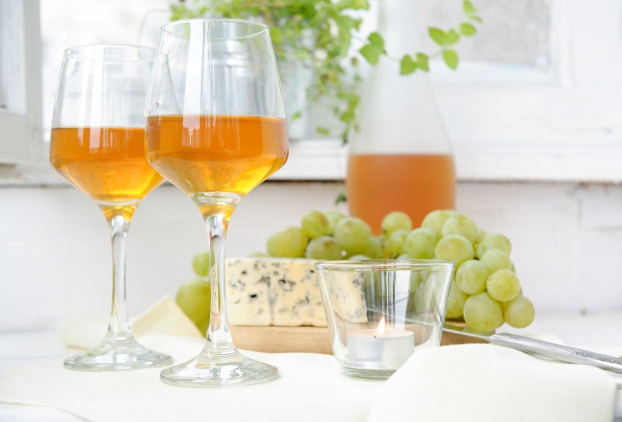 two glasses of wine, grapes and blue cheese