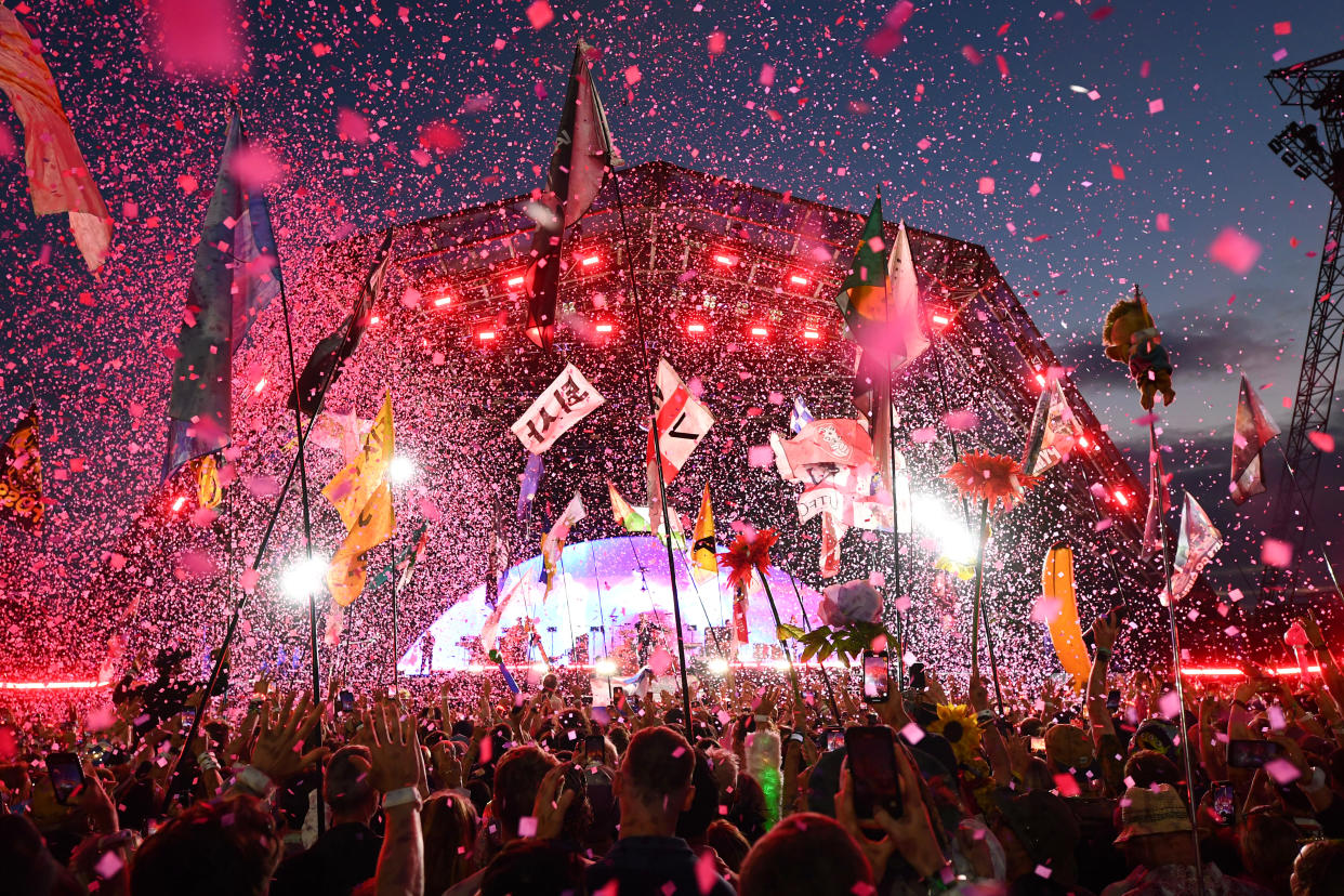 A general view of the crowd listening to ColdPlay perform during day four of Glastonbury Festival 2024 at Worthy Farm, Pilton on June 29, 2024 in Glastonbury, England. Founded by Michael Eavis in 1970, Glastonbury Festival features around 3,000 performances across over 80 stages. Renowned for its vibrant atmosphere and iconic Pyramid Stage, the festival offers a diverse lineup of music and arts, embodying a spirit of community, creativity, and environmental consciousness. (Photo by Joe Maher/Getty Images)