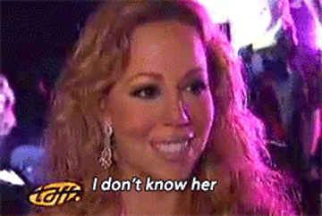 Mariah Carey smiling with the caption "I don't know her" displayed, suggesting a dismissive response to a question