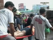 ATTENTION EDITORS - VISUAL COVERAGE OF SCENES OF INJURY OR DEATH A woman is carried on a stretcher towards an ambulance after buildings collapsed during an earthquake in Cebu City, Philippines, in this October 15, 2013 still image taken from video. At least six people were killed when buildings collapsed on islands popular with tourists in the central Philippines on Tuesday, radio reports said, after an earthquake measuring 7.2 hit the region. REUTERS/ABS-CBN via Reuters TV (PHILIPPINES - Tags: DISASTER ENVIRONMENT) ATTENTION EDITORS - NO SALES. NO ARCHIVES. FOR EDITORIAL USE ONLY. NOT FOR SALE FOR MARKETING OR ADVERTISING CAMPAIGNS. THIS IMAGE HAS BEEN SUPPLIED BY A THIRD PARTY. IT IS DISTRIBUTED, EXACTLY AS RECEIVED BY REUTERS, AS A SERVICE TO CLIENTS. PHILIPPINES OUT. NO COMMERCIAL OR EDITORIAL SALES IN PHILIPPINES