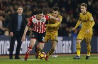 Britain Soccer Football - Southampton v Tottenham Hotspur - Premier League - St Mary's Stadium - 28/12/16 Tottenham's Kyle Walker in action with Southampton's Pierre-Emile Hojbjerg as Tottenham's Christian Eriksen and Southampton manager Claude Puel look on Action Images via Reuters / Matthew Childs Livepic