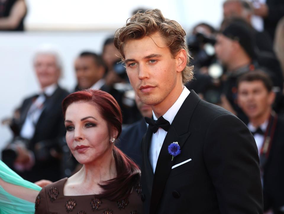 Priscilla Presley, left, and Austin Butler pose for photographers upon arrival at the premiere of the film "Elvis" at the 75th international film festival, Cannes, southern France, Wednesday, May 25, 2022.