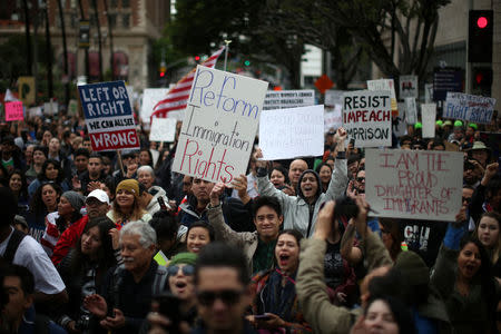 People participate in a protest march calling for human rights and dignity for immigrants, in Los Angeles, February 18, 2017. REUTERS/Lucy Nicholson