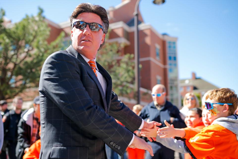 Mike Gundy will participate in his 400th game as an Oklahoma State coach and player when the Cowboys play at West Virginia on Saturday.