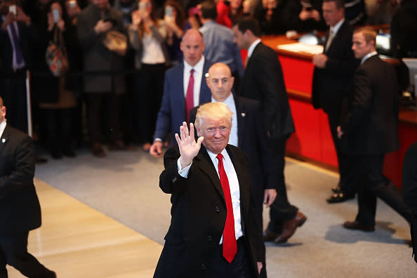 President-elect Donald Trump walks through the lobby of the New York Times following a meeting with editors at the paper on November 22, 2016 in New York City. | Spencer Platt—2016 Getty Images