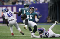 New York Giants' Xavier McKinney, right, trips up Philadelphia Eagles' Dallas Goedert (88) during the first half of an NFL football game, Sunday, Nov. 28, 2021, in East Rutherford, N.J. (AP Photo/Corey Sipkin)