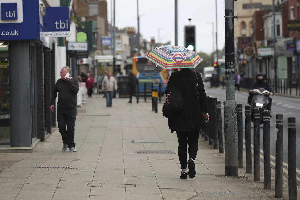 People walk along the high street in Hartlepool northeast England, Saturday, June 29, 2024. As British voters prepare to choose a new government on Thursday, Hartlepool’s statistics still tell a sobering story. Compared the country as a whole, it has higher unemployment, lower pay, shorter life expectancy, more drug deaths and worse crime rates. (AP Photo/Scott Heppell)