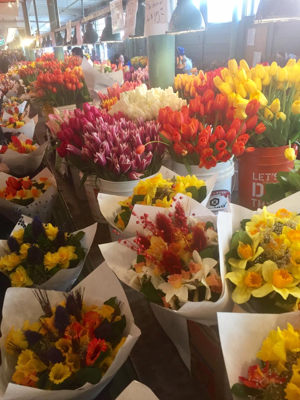 Pike Place Market is alive with flower vendors and free to window shoppers.