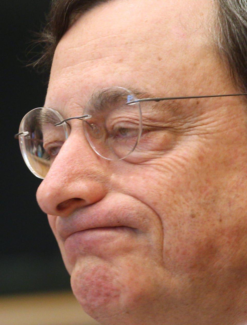 President of the European Central Bank Mario Draghi reports to the Economic Committee, in capacity as the head of the European Systemic Risk Board, at the European Parliament in Brussels, Thursday, May 31, 2012. (AP Photo/Yves Logghe)