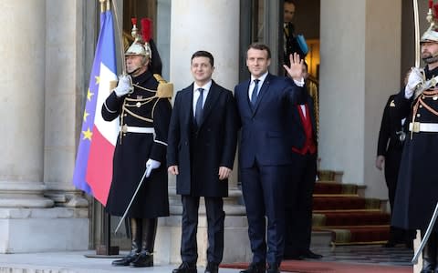 French President Emmanuel Macron (R) welcomes Ukrainian president Volodymyr Zelenskiy - Credit: AFP