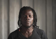 Moussa Fanta, 27, from Guinea, poses for a portrait aboard the humanitarian rescue ship Ocean Viking, in Italian waters off the Sicilian town of Messina, southern Italy, Monday, Sept. 23, 2019, hours before disembarking. He is known as Rozy back home and loves reggae. He was in awe of a gargantuan cruise ship moored on the other side of the straight of Messina when the Ocean Viking docked in Italy Tuesday. “It’s so amazing!” he said. (AP Photo/Renata Brito)