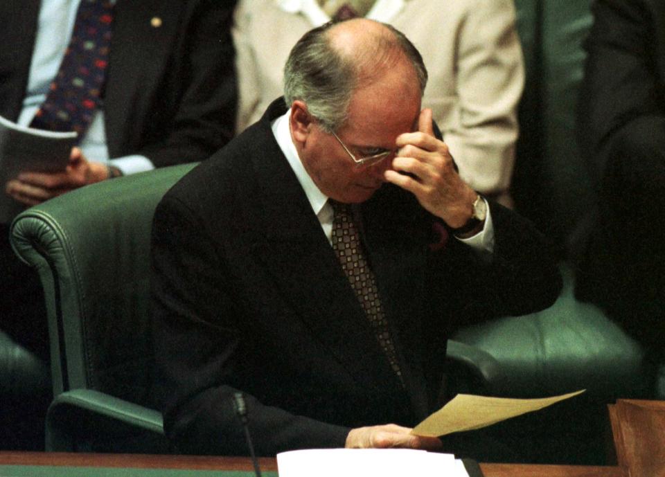 Prime Minister John Howard with his head in his hand in parliament in 1998.