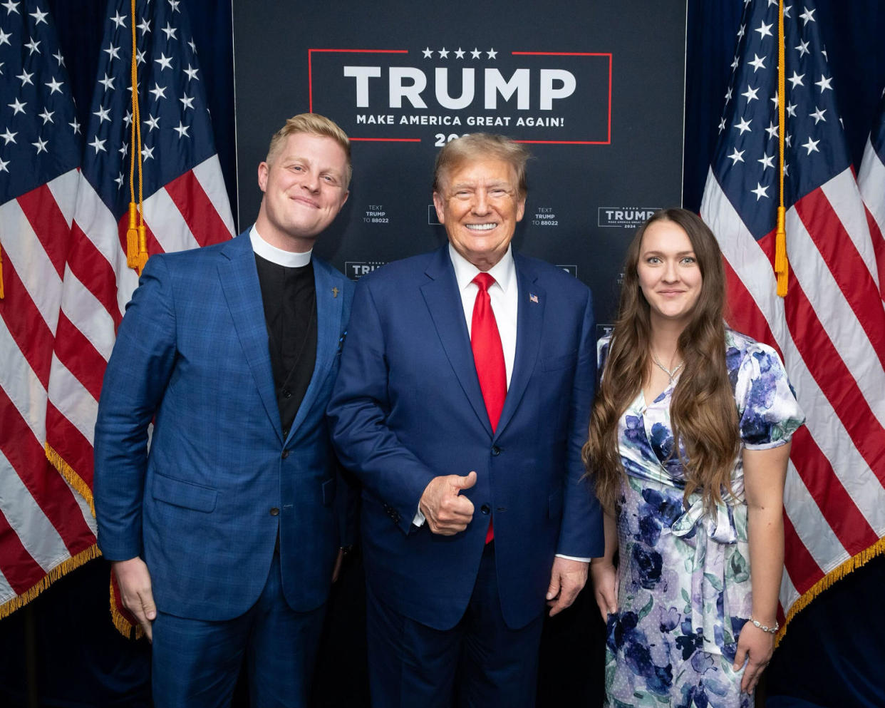 The Rev. Joel Tenney, pictured here with his wife, Sarah, and Trump, prayed at a December rally in Coralville, Iowa. (Courtesy Joel Tenney)