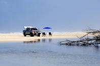 Australia’s Fraser Island, the world’s largest sand island and a World Heritage Site, offers the pleasures of beach life and treks in its dense rainforests. 