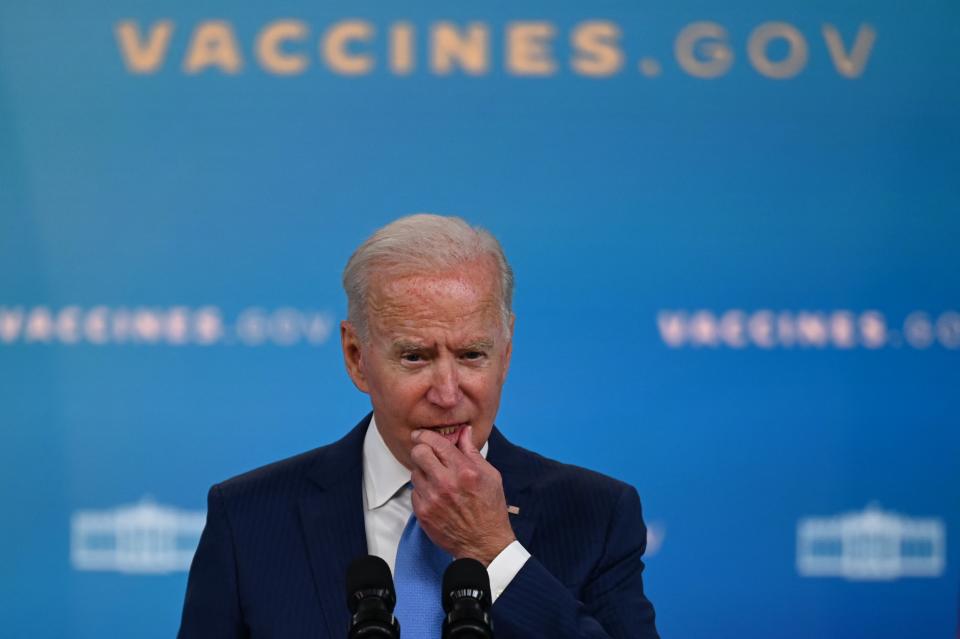 TOPSHOT - US President Joe Biden delivers remarks on the Covid-19 response and the vaccination program at the White House on August 23, 2021 in Washington,DC. - The US Food and Drug Administration on Monday fully approved the Pfizer-BioNTech Covid vaccine, a move that triggered a new wave of vaccine mandates as the Delta variant batters the country.Around 52 percent of the American population is fully vaccinated, but health authorities have hit a wall of vaccine hesitant people, impeding the national campaign. (Photo by Jim WATSON / AFP) (Photo by JIM WATSON/AFP via Getty Images)