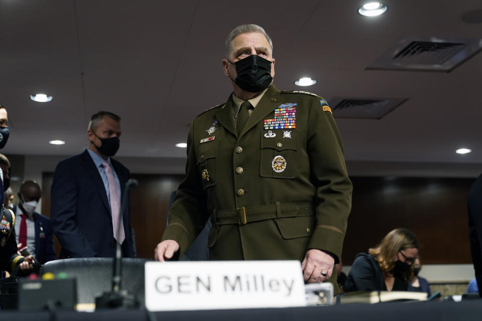 FILE - Chairman of the Joint Chiefs of Staff Gen. Mark Milley arrives before a Senate Armed Services Committee hearing on the conclusion of military operations in Afghanistan and plans for future counterterrorism operations, Sept. 28, 2021, on Capitol Hill in Washington. Milley has tested positive for COVID-19 and is experiencing very minor symptoms, a spokesperson said Monday. (AP Photo/Patrick Semansky, Pool, File)