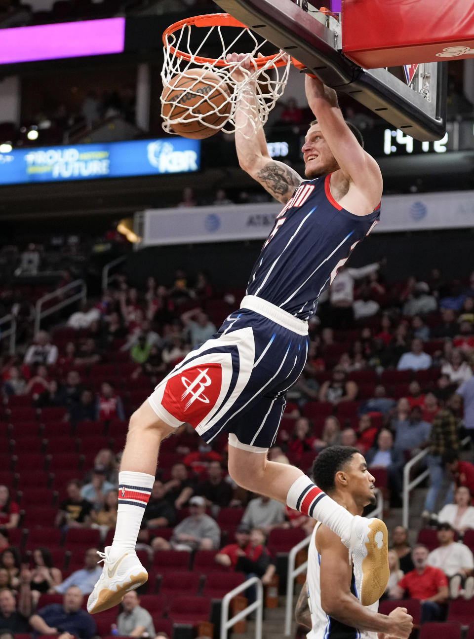 Houston Rockets guard Garrison Mathews dunks during the first half of the team's NBA basketball game against the Orlando Magic, Friday, Dec. 3, 2021, in Houston. (AP Photo/Eric Christian Smith)