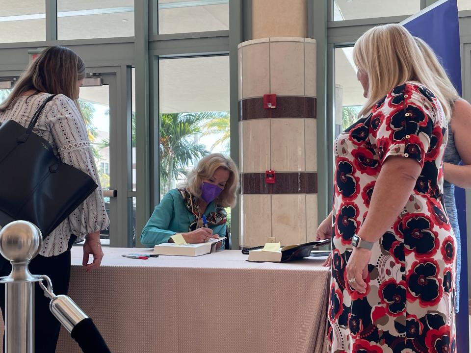 Former White House Coronavirus Response Coordinator Deborah Birx signs copies of her new book "Silent Invasion" at the Kravis Center in West Palm Beach Monday.