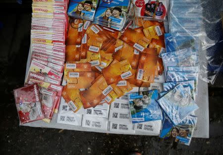 SIM cards are displayed along Latha street in Yangon, Myanmar, August 8, 2018. REUTERS/Ann Wang