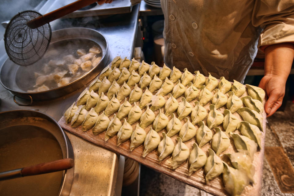 A chef prepares dumplings in a restaurant in China Town on Feb. 18, 2015 in London, England. Carl Court—Getty Images