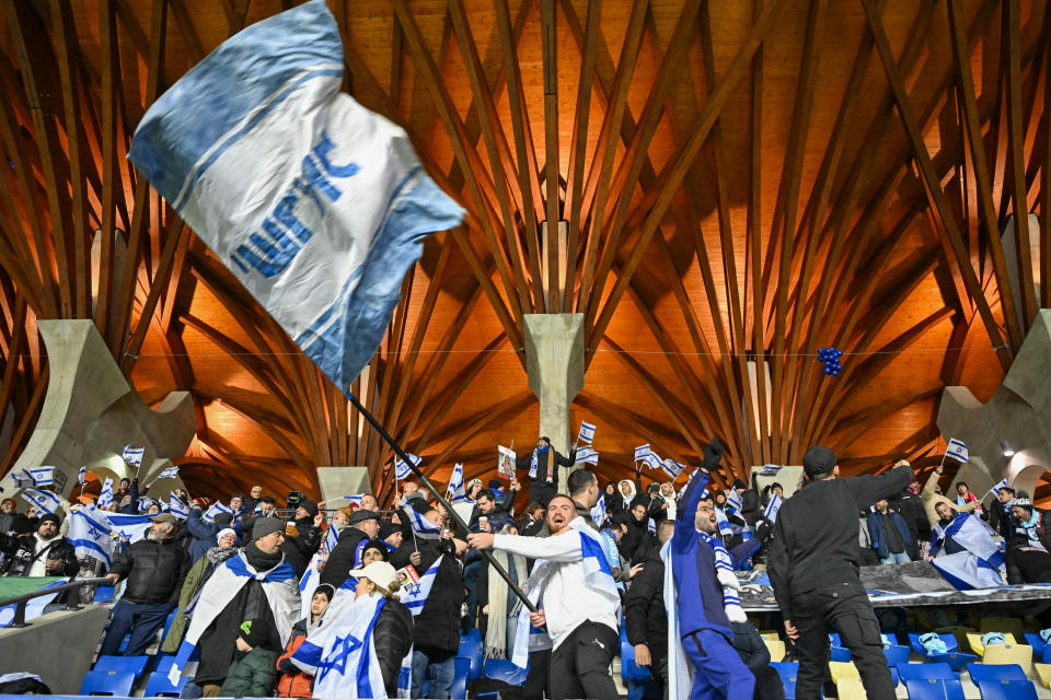 Israel fans support their team prior the Euro 2024 group I qualifying soccer match between Israel and Romania at the Pancho Arena in Felcsut, Hungary, Saturday, Nov. 18, 2023. (AP Photo/Denes Erdos)