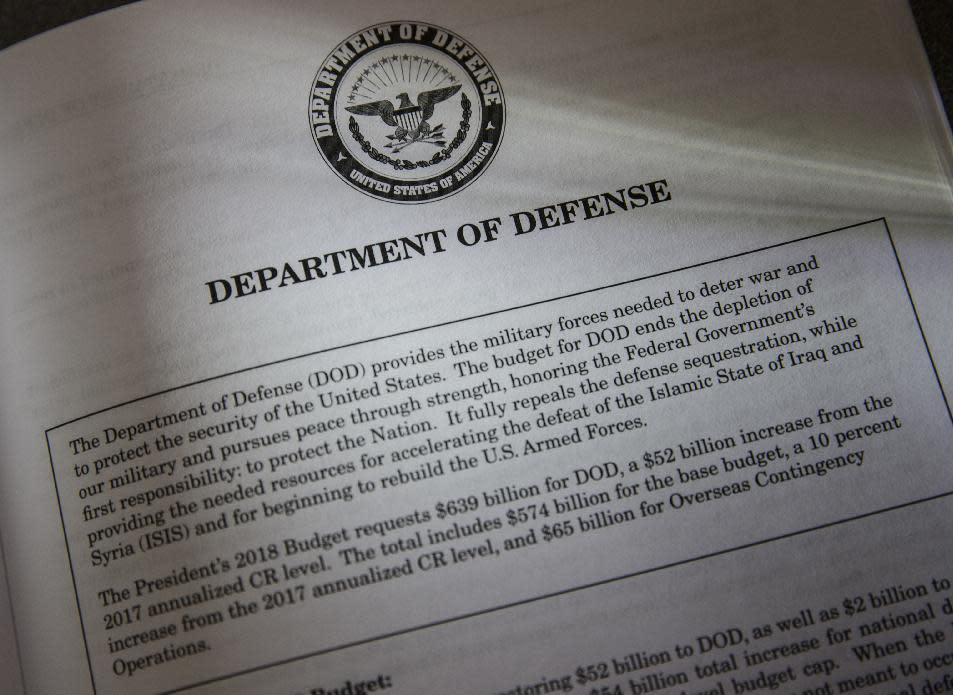 Proposals for the Defense Department in President Donald Trump's first budget are displayed at the Government Printing Office in Washington, Thursday, March, 16, 2017. The $1.15 trillion presentation proposes a reordering of national spending priorities, pumping significantly more money into the military and homeland security while sharply cutting foreign aid, medical research and the arts. The document also proposes money for the U.S.-Mexico border wall Trump vowed in his campaign to have Mexico finance. The EPA also takes a big hit in the budget proposal. (AP Photo/J. Scott Applewhite)