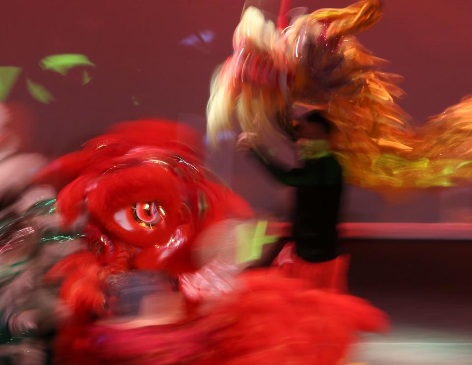 Performers are a swirl of motion and color during a lion dance as part of the University of Delaware's Chinese New Year Gala Saturday evening at Mitchell Hall. The Year of the Dog began Friday on the Chinese calendar. Feb. 17, 2018.