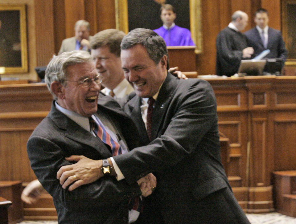 FILE - Speaker of the House Bobby Harrell,R-Charleston, right, gives Senate Finance committee chairman, Sen. Hugh Leatherman, R-Florance, a hug after he ratified acts on the last day of the session Thursday, June 7, 2007, at the Statehouse in Columbia, S.C. Leatherman, South Carolina’s oldest and most powerful state lawmaker, died Friday, Nov. 12, 2021 at the age of 90. (AP Photo/Mary Ann Chastain, File)