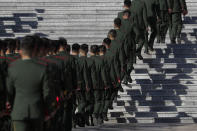 Chinese paramilitary policemen arrive to the Great Hall of the People to attend the commemorating conference on the 70th anniversary of China's entry into the 1950-53 Korean War, in Beijing Friday, Oct. 23, 2020. (AP Photo/Andy Wong)