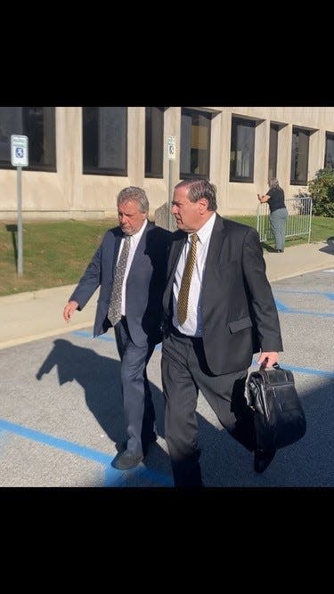 Neil DeLuca, left, leaves Mount Pleasant Town Court Oct. 26, 2023 with his lawyer Michael Santangelo after his arraignment on a hit-and-run charge.